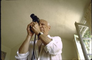 Artist Pablo Picasso taking photograph during visit w. photographer Gjon Mili at his home in Notre-Dame-de-Vie, Mougins. (Photo by Gjon Mili/The LIFE Picture Collection/Getty Images)